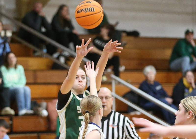 St. Bede's Quinn McClain shoots a jump shot over Marquette's Keeley Nelson during the Tri-County Conference championship game on Thursday, Jan. 23, 2025 at Roanoke-Benson High School.