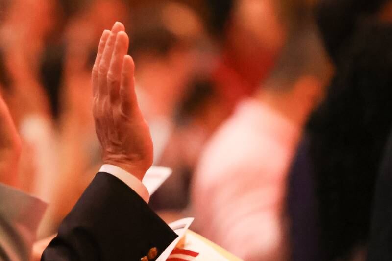 101 applicants for U.S. citizenship from 27 countries take the Oath of Allegiance during the Special Naturalization Ceremony held at the Rialto Square Theatre in downtown Joliet on Tuesday, April 23, 2024.