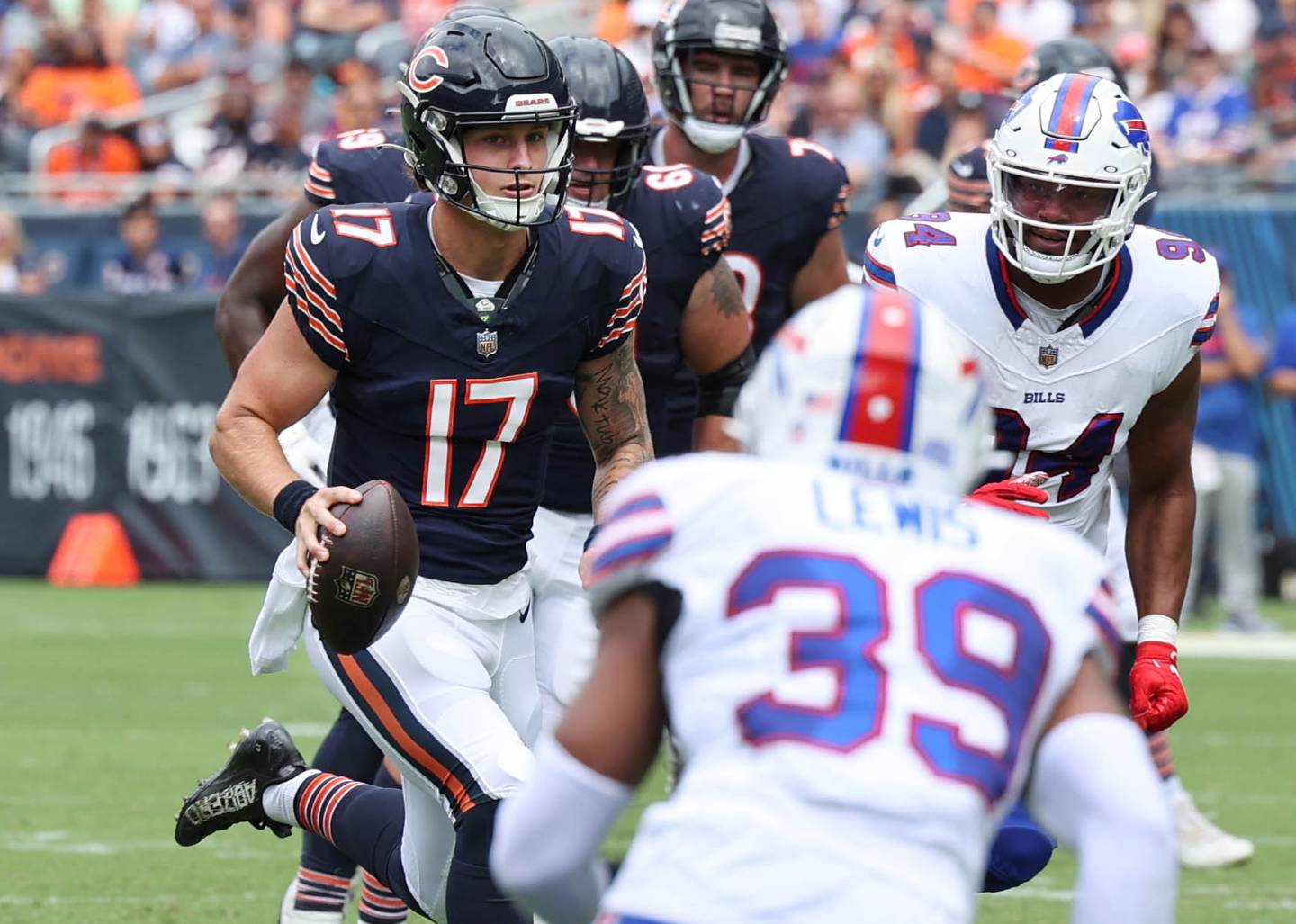 Chicago Bears quarterback Tyson Bagent scrambles through the Buffalo Bills pass rush for a good gain during their preseason game Saturday, Aug. 26, 2023, at Soldier Field in Chicago.