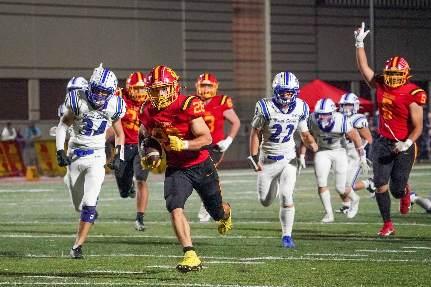 Batavia’s Nathan Whitwell (28) carries the ball for a touchdown against St. Charles North during a football game at Batavia High School on Friday, Sep 20, 2024.