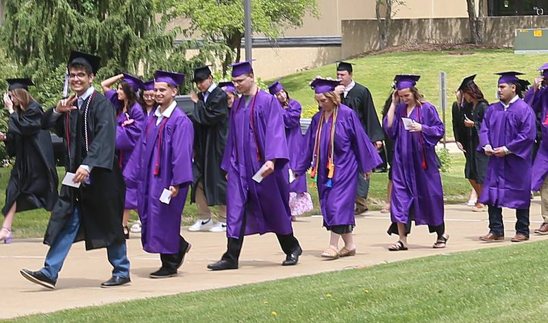 Illinois Valley Community College graduates walk in procession as they enter the gymnasium during the 59th annual Commencement Ceremony on Saturday, May 17, 2025 at IVCC.
