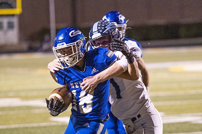 Newman’s Brady Grennan fights for yards against Bureau Valley’s Bryce Helm Friday, Sept. 29, 2023 in Sterling.