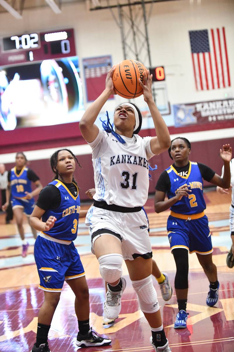 Kankakee's TaLeah Turner hits a layup past Crete-Monee defenders on Thursday, Feb. 6, 2025, during the Kays' victory over Crete-Monee.