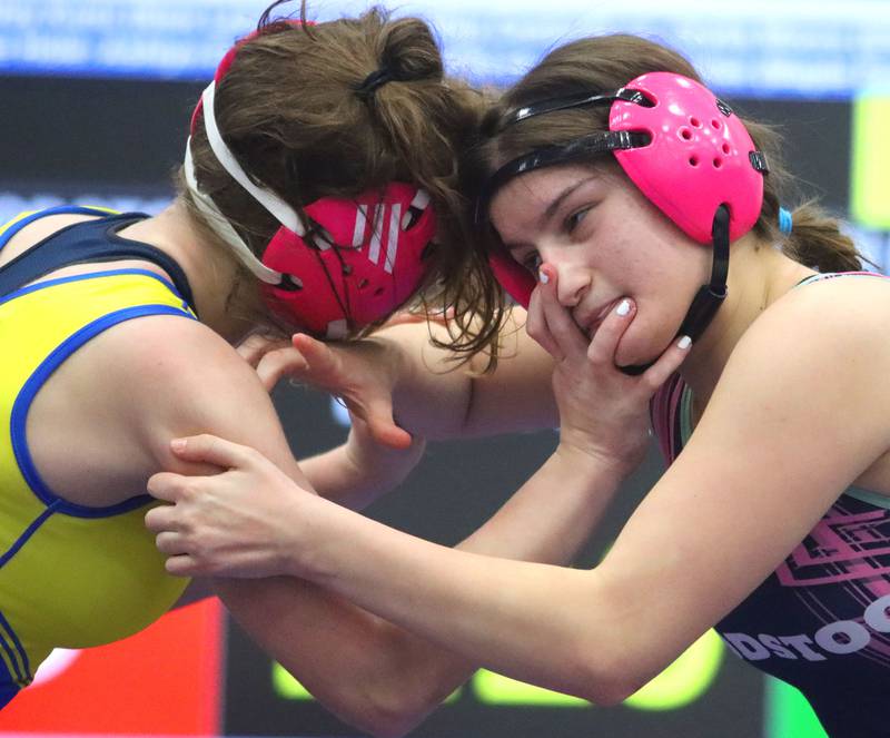Woodstock’s Ava Kok, right, battles Wheaton North’s Isabelle Harty at 140 pounds in Whip-Pur Women’s Classic varsity girls wrestling on Saturday, Dec. 20, 2025, at Hampshire High School in Hampshire.