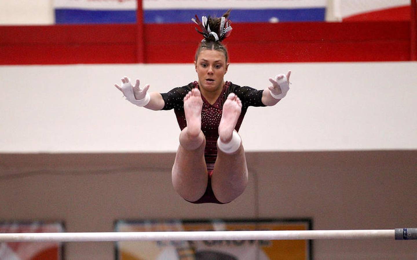 Prairie Ridge co-op's Gabby Riley competes on the uneven parallel bars during the 2020 IHSA State Gymnastics Individual Finals at Palatine High School on Feb. 22.