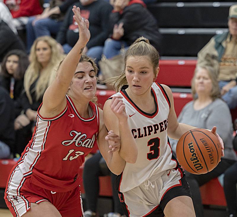 Amboy’s Elly Jones handles the ball against Hall’s McKenna Christiansen Wednesday, Dec. 27, 2023 during the Amboy Holiday Basketball tournament.