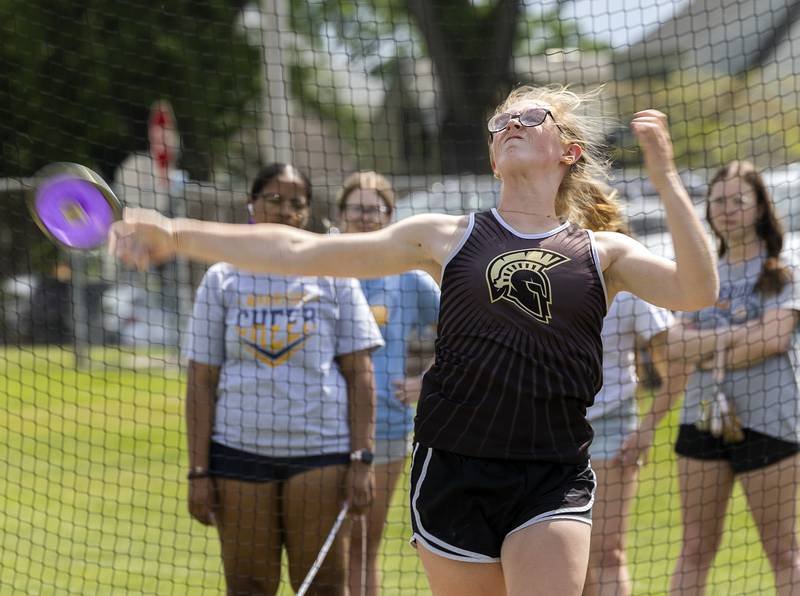 Sycamore’s Krista Cobb fires the discus Wednesday, May 14, 2025, during Sectionals at Sterling High School.