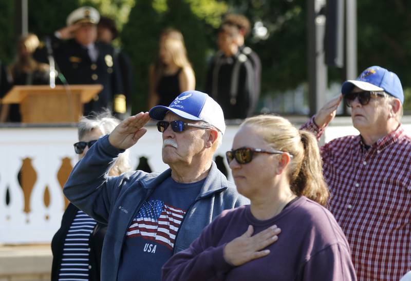 People listen as the National Anthem is performed by the McHenry High School Choir during a September 11 Remembrance Ceremony on Sept. 11, 2025, at Veterans Park in McHenry.