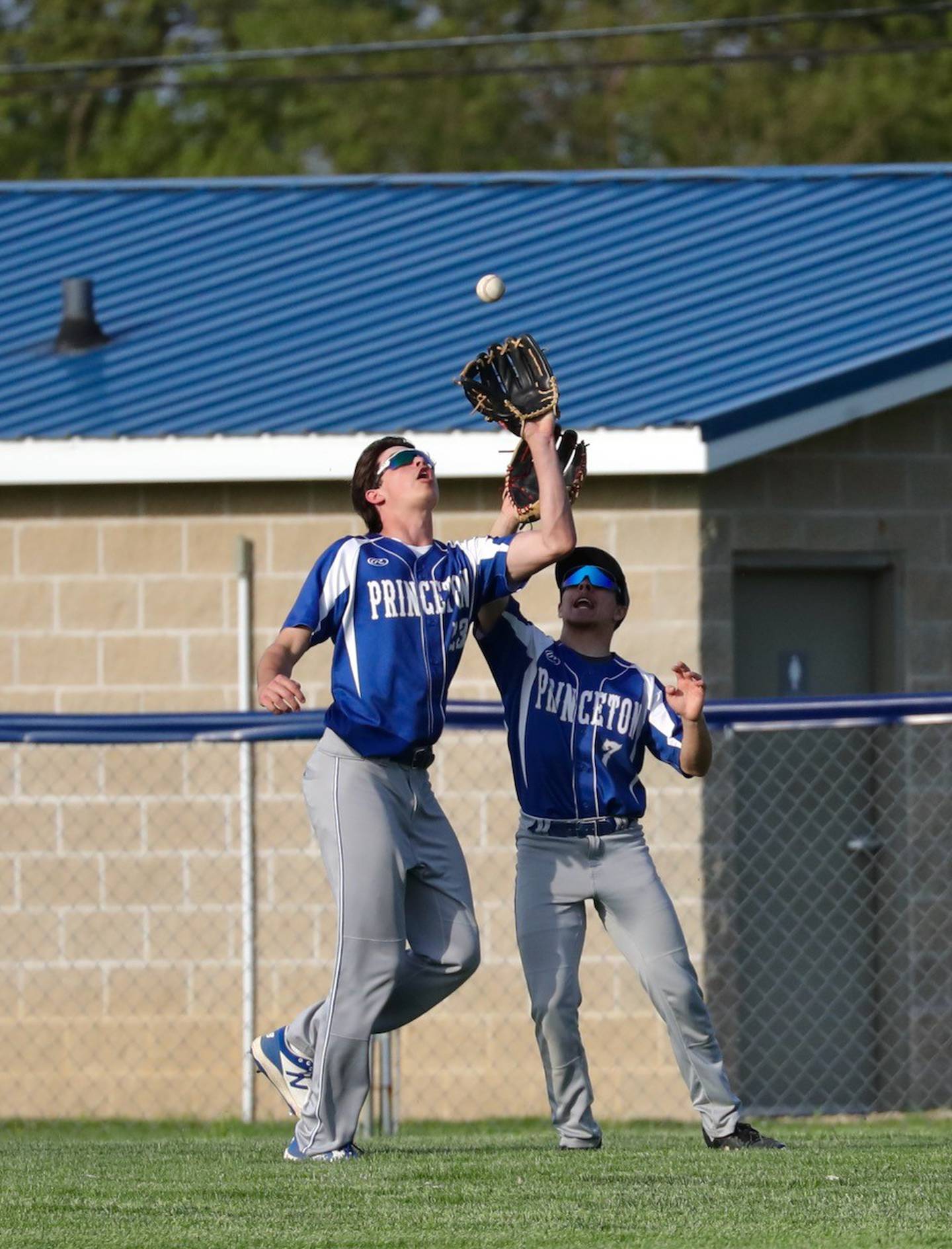 Princeton center fielder Noah LaPorte catches a fly ball in front of teammate Augie Christiansen at Prather Field on Tuesday.