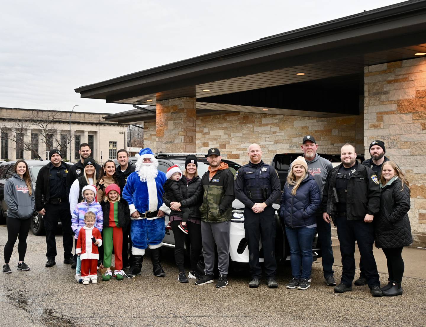 Friends, families and officers came out Saturday to deliver gifts as a part of La Salle's Officer Santa Program on Dec. 16.