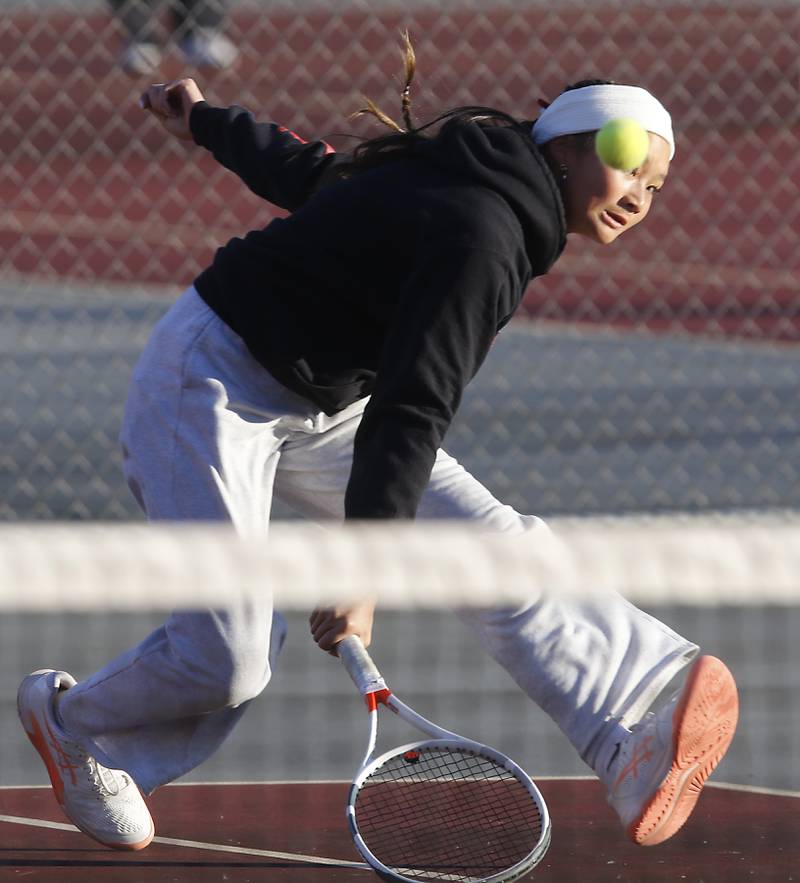 Marian Central’s Jordan Cheng returns the ball Thursday, Oct. 23, 2025, during the first day of the IHSA State Girls Tennis Tournament at Schaumburg High School.