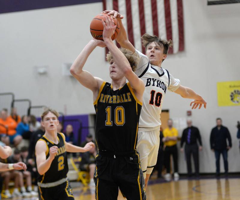 Byron's Ryan Tucker (10) blocks a shot by Riverdale's Brody Clark (10) at the 2A Mendota Sectional on Wednesday, Feb. 28, 2024 at Mendota High School.