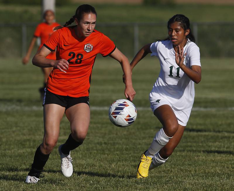 Crystal Lake Central's Jillian Mueller lines up her goals scoring pass as she is defended by Boylan’s Mary Therese Harrison  during the IHSA Class 2A Burlington Central Girls Soccer Sectional final match Friday, May 26, 2023, at Burlington Central High School.