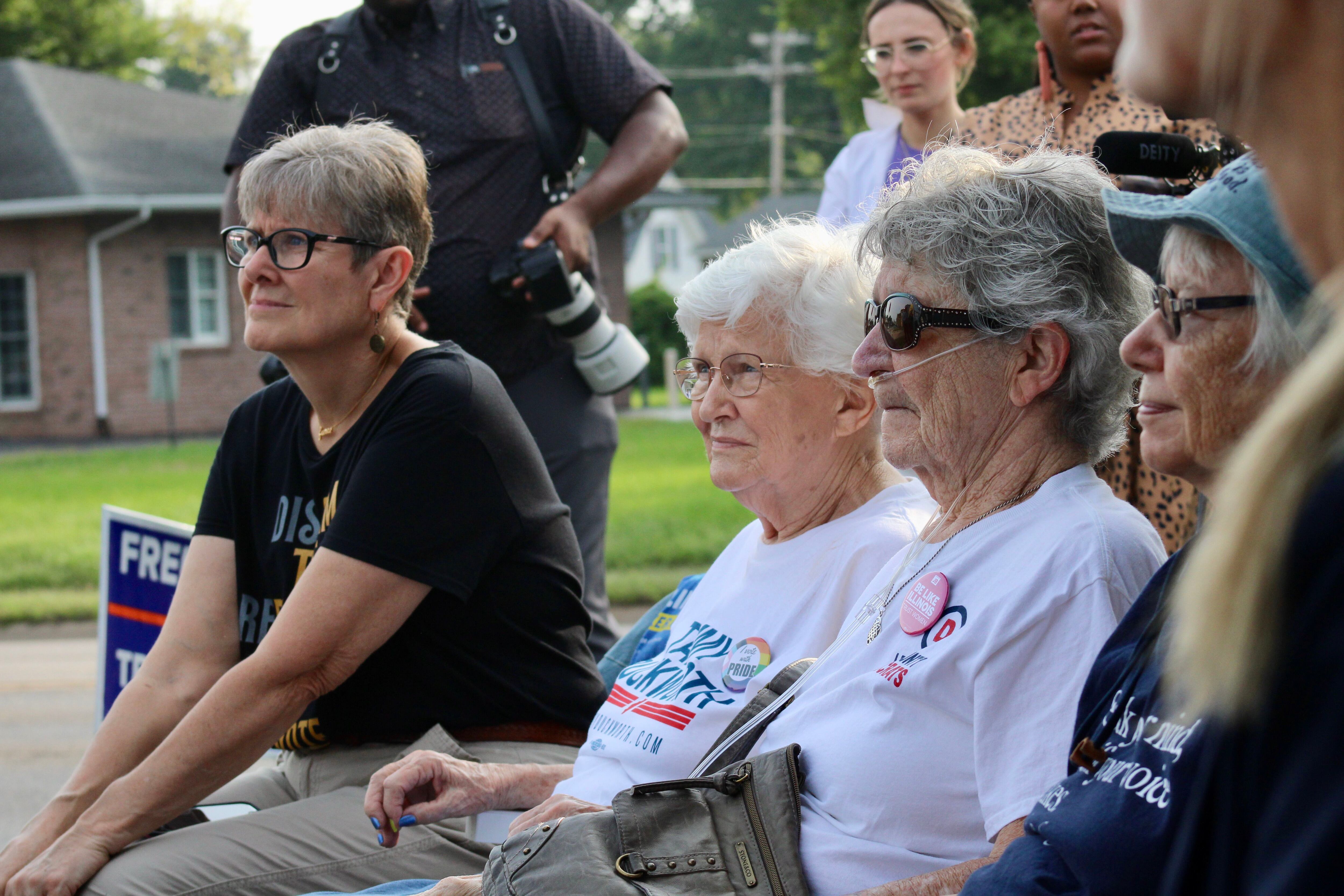 Voters listen to Gov. JB Pritzker during a campaign stop on Sunday at the Whiteside County Democratic headquarters in Rock Falls.