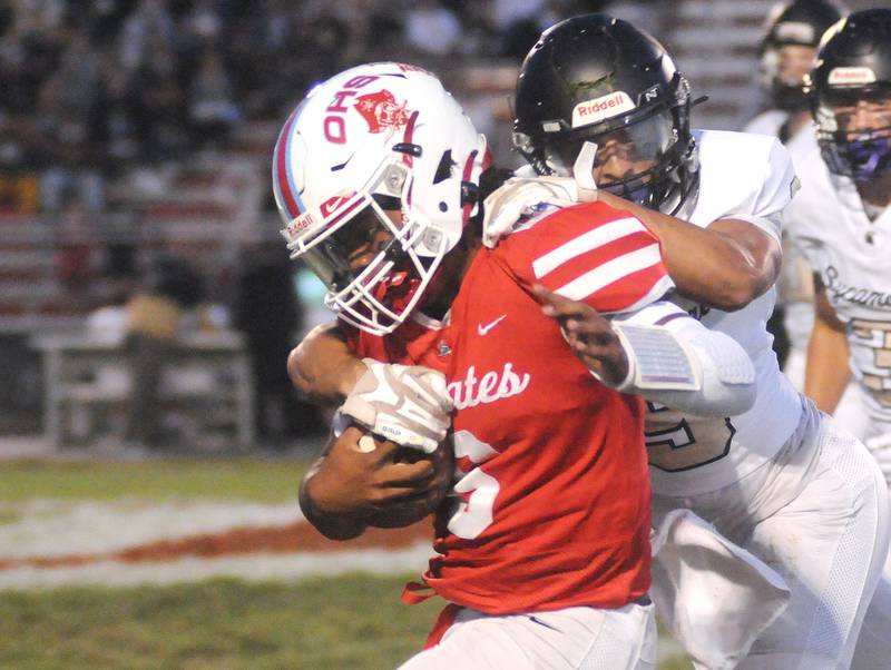 Sycamore's Miles Galindo tackles Ottawa quarterback Colby Mortenson at King Field on Friday, Sept. 15, 2023.