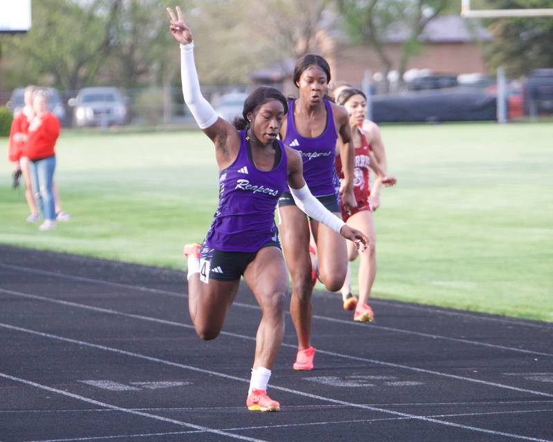 Plano's Armoney Clay and Favour Amakari compete in the 100 Meter Dash at the Interstate 8 Girl's track meet on Friday, May,5,2023 in Sycamore.