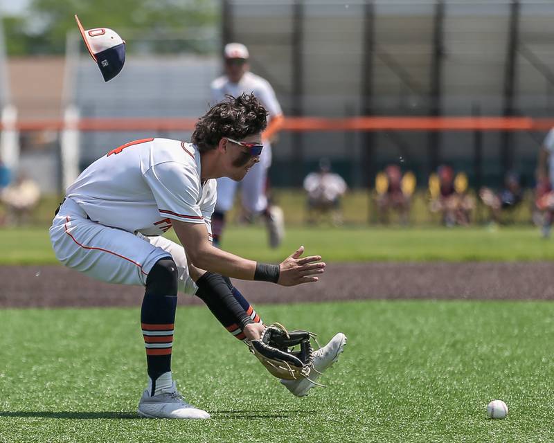 Oswego's Trey Hernandez (14) fields a grounder during Class 4A Romeoville Sectional final game between Oswego East at Oswego.  June 3, 2023.