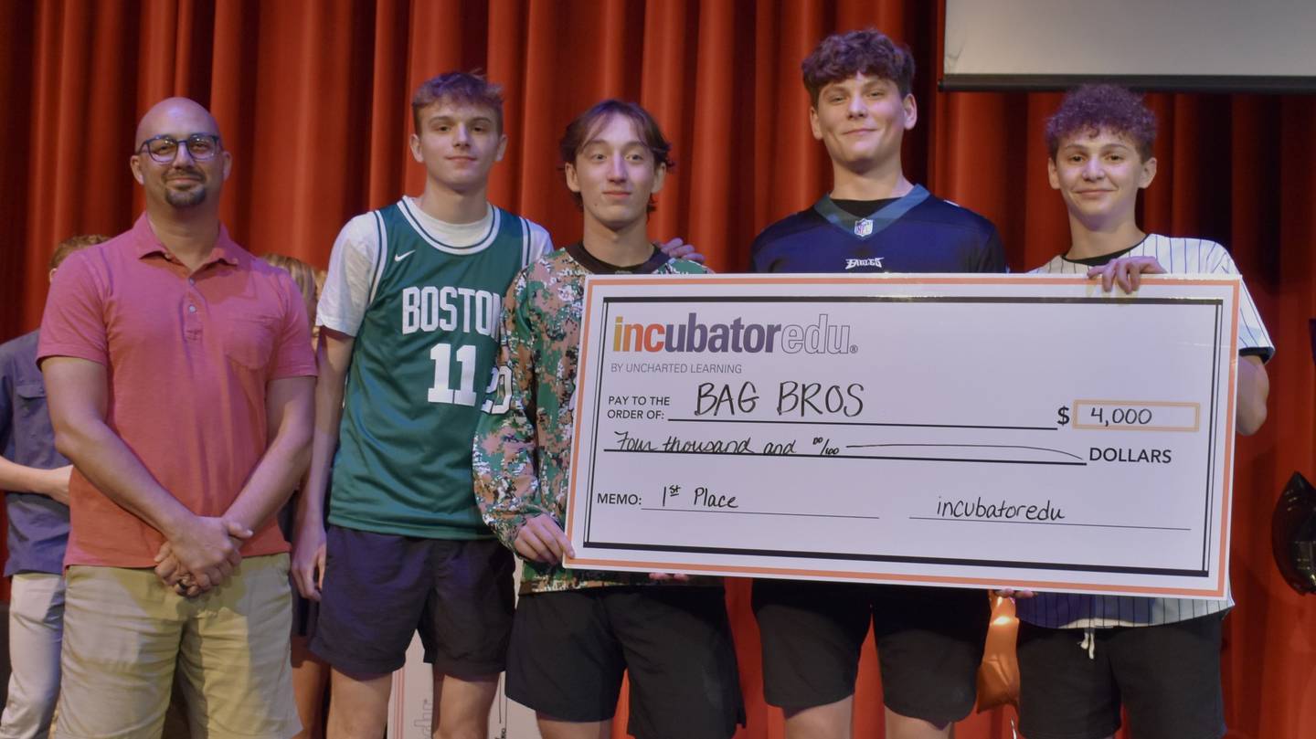 Bagbros team members and mentor pose for photos after winning first place at the annual Final Pitch Night at St. Charles North High School Tuesday May 16, 2023.
(from left to right: Abraham Marshal, Jack Borri, Justin Smith, Jake Vrankovich and Anthony Iori)