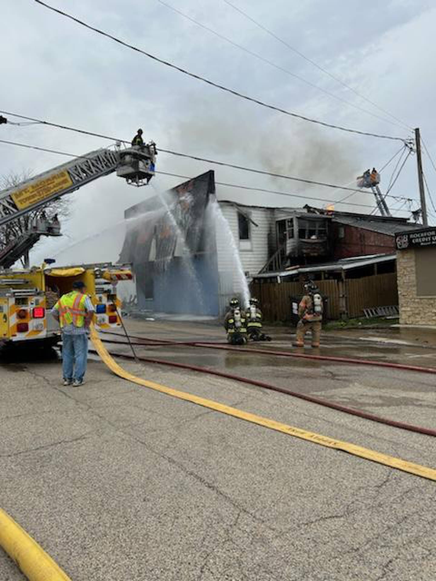 Firefighters from multiple departments battle a blaze at Sharky's, a bar in Mt. Morris, Tuesday, April 16, 2024.