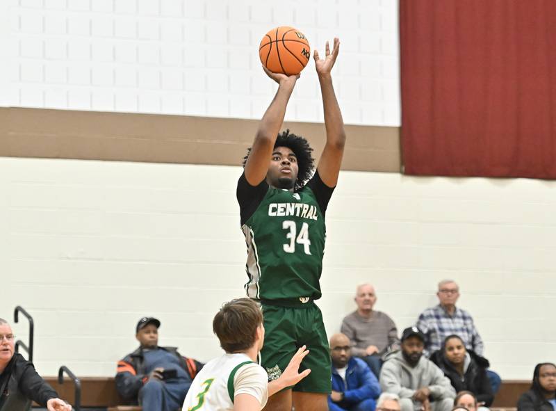 Plainfield Central's Ares Collins (34) shoots a jump shot over Providence Catholic's Luke Rost (3) during the WJOL tournament game on Friday, NOV. 28, 2025, at Joliet.