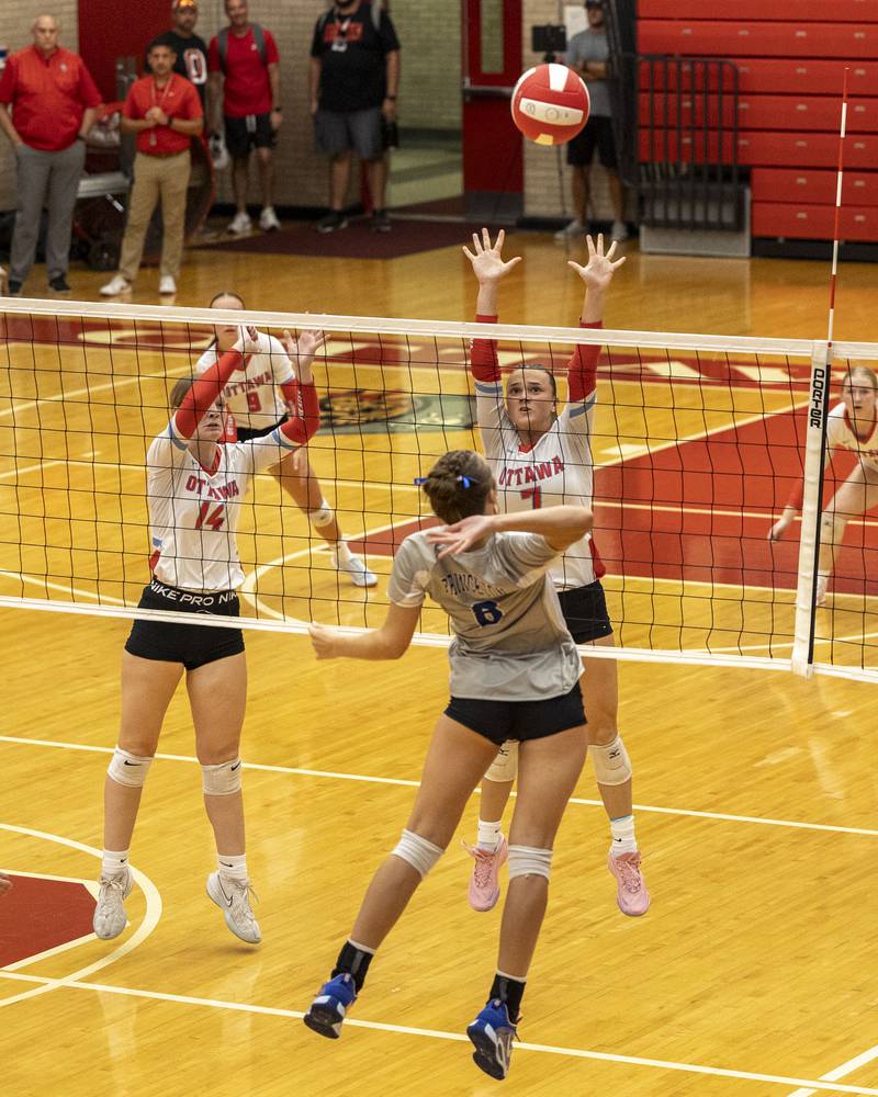Keighley Davis (8) of Princeton jumps to hit volleyball over net to Ottawa's defense on Thursday, Sept. 18, 2025 at Ottawa High School in Ottawa.