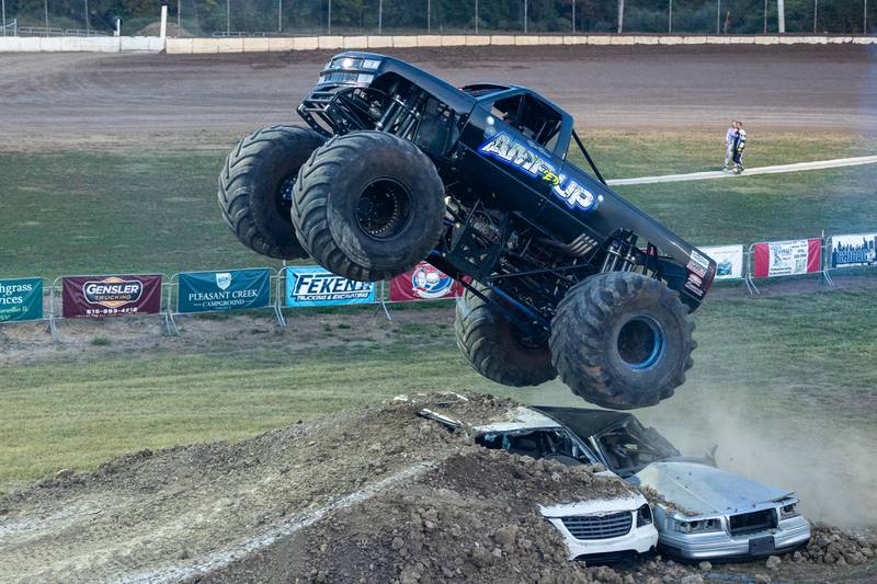 Driver of the Monster Truck 'Amp'ed Up' flies over 2 cars and ramp at the Monster Truck Bash on Saturday, Sept. 13, 2025 at the La Salle Speedway in La Salle.