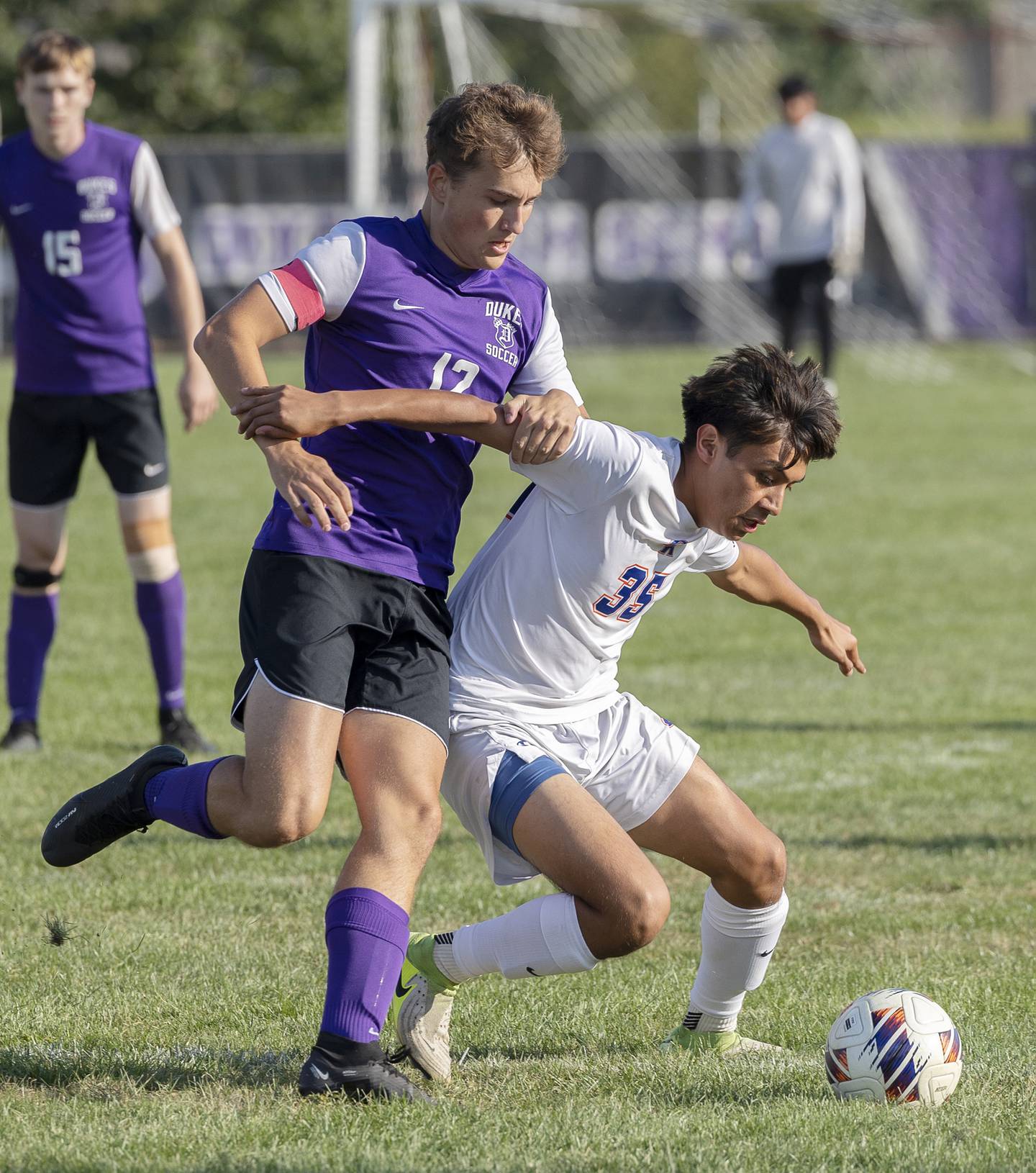 Dixon’s Marques Flanagan chases Genoa-Kingston’s Chris Fuentes for the ball Tuesday, Sept. 2, 2025.