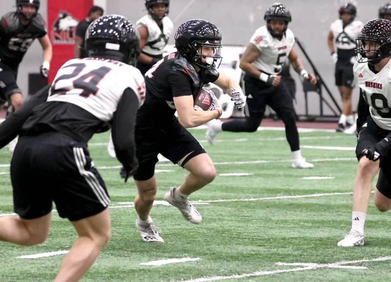 Northern Illinois wide receiver George Dimopoulos, from Crystal Lake, carries the ball after a catch during the first spring football practice Thursday, March 27, 2025, in the Chessick Practice Center at NIU in DeKalb.