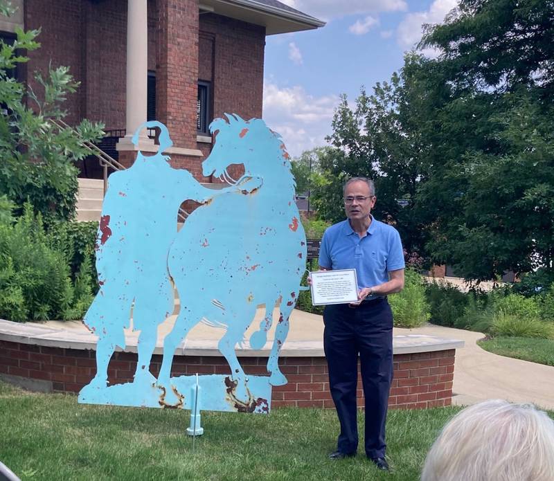 John Ruark, son of the late Geneva artist and sculptor Sally Ruark, holds a dedication plaque to be placed at her sculpture ‘George Washington and his Horse Nelson.’ Ruark’s family donated the sculpture to the city, and it was installed on the southwest lawn of City Hall.