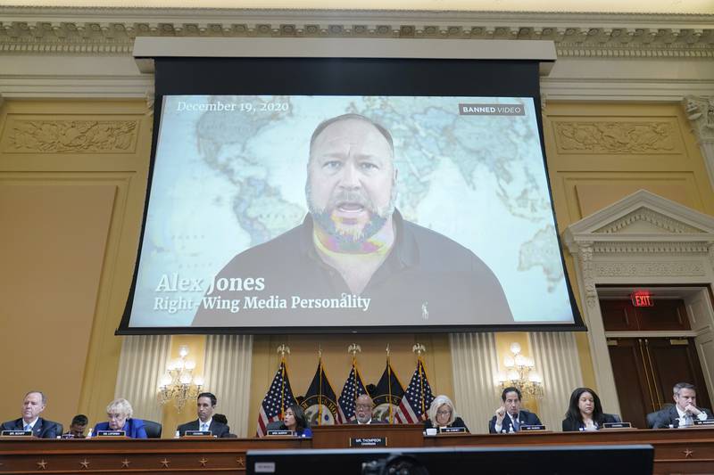 FILE - In this July 12, 2022 file photo, a video showing Alex Jones is shown as the House select committee investigating the Jan. 6 attack on the U.S. Capitol holds a hearing at the Capitol in Washington. An attorney representing two parents who sued Jones over his false claims about the Sandy Hook massacre says the U.S. House Jan. 6 committee has requested two years’ worth of records from Jones’ phone. Attorney Mark Bankston said in court Thursday, Aug. 4, 2022 that the committee investigating the attack on the U.S. Capitol has requested the digital records. (AP Photo/Jacquelyn Martin, File)