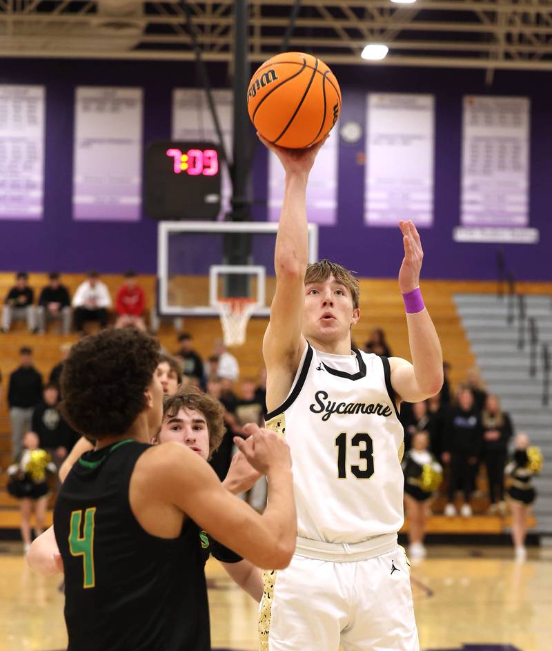Sycamore's Xander Lewis shoots over Crystal Lake South's AJ Demirov during their sectional semifinal game Tuesday, March 4, 2025, at Rochelle High School.