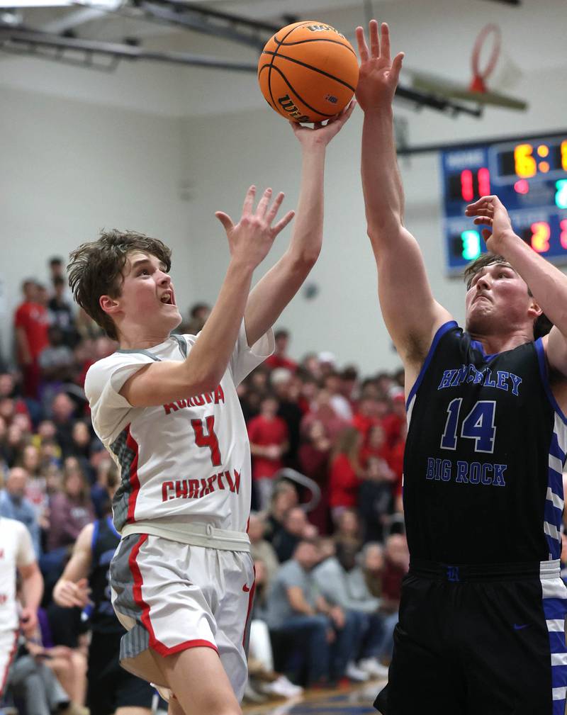 Aurora Christian's Joe DeCort tries to score over Hinckley-Big Rock's Martin Ledbetter during their sectional final game Friday, March 7, 2025, at Somonauk High School.