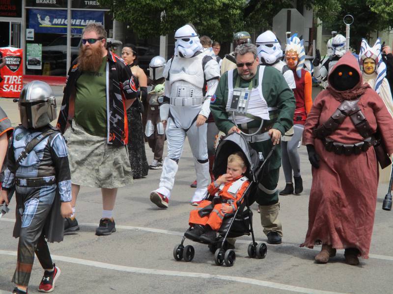 The cast of costumed characters that attract people to Star Wars Day in Joliet march in the parade that led off the event on Saturday, June 4, 2022.