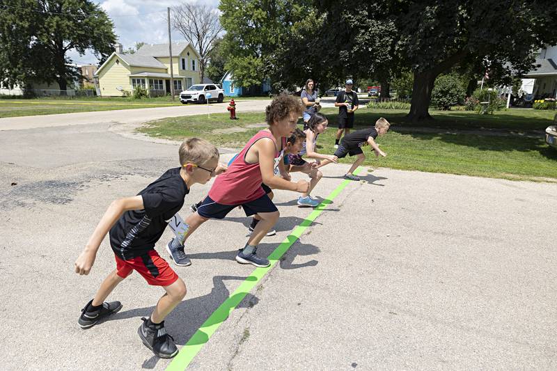 The last and oldest group of runners prepare to fire off the starting line Saturday, July 22, 2023 during the Tampico Day’s kids fun run.