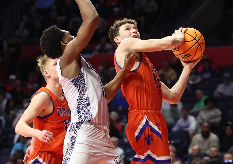 Eastland's Peyton Spears goes to the basket against Chicago Hope Academy's Dominick Hale during their IHSA Class 1A state championship game Saturday, March 15, 2025, in the State Farm Center at the University of Illinois in Champaign.