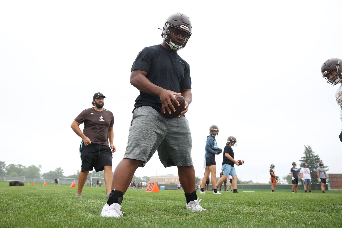 Joliet Catholic’s Dillan Johnson works on offensive line drills during practice. Monday, Aug. 8, 2022, in Joliet.