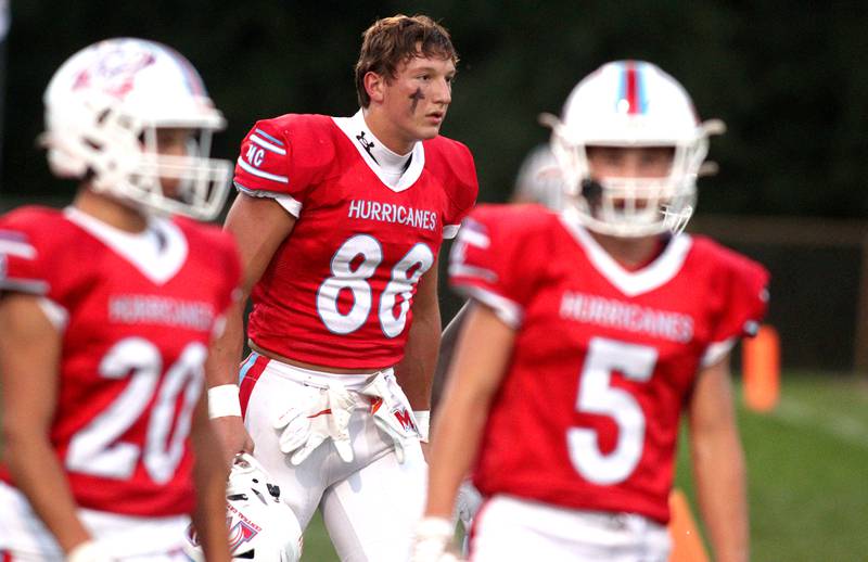 Marian Central’s Christian Bentancur walks to the field before facing Chicago Hope in varsity football at Woodstock Friday night.