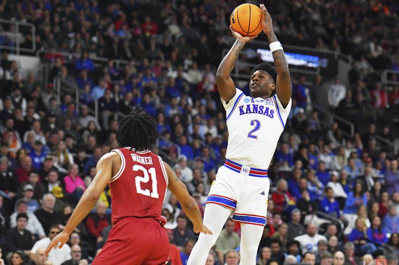 Kansas guard AJ Storr (2) takes a shot against Arkansas during the first half in the first round of the NCAA college basketball tournament, Thursday, March 20, 2025, in Providence, R.I. (AP Photo/Steven Senne)