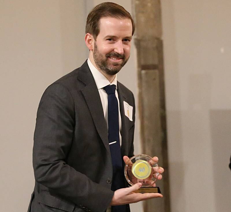 Cote Klinefelter, Attorney- Partner, Herbolsheimer, Duncan, Eiten, Hintz & Klinefelter, P.C. poses with his award during the Illinois Valley Chamber of Commerce 40 Under Forty Awards Gala on Thursday, Feb. 9, 2023 at Westclox in Peru.