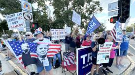 Anti- and pro-Trump signs displayed during ‘Workers Over Billionaires’ rally in downtown Oregon