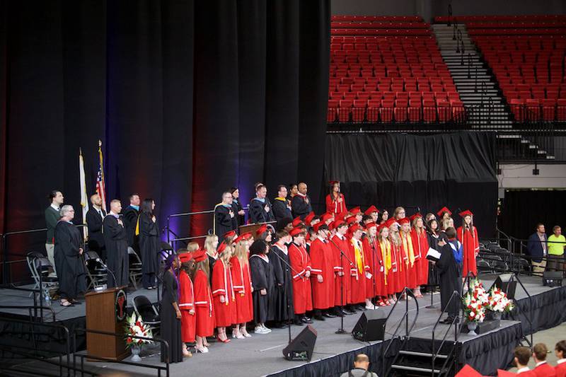Yorkville High School Varsity Choir perform at the  Commencement Ceremony at NIU Convocation Center on Friday, May 16, 2025 in DeKalb.