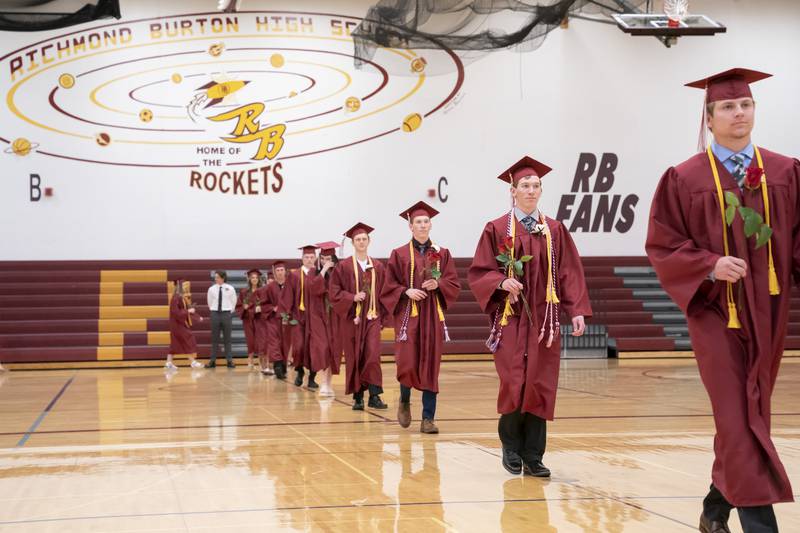 Seniors march into the gym during a graduation ceremony for the class of 2022 on Sunday, May 22, 2022, at Richmond-Burton Community High School in Richmond.