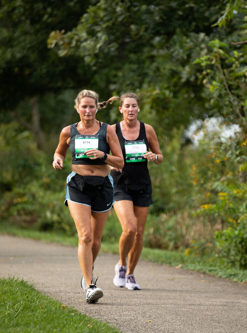 Fox Valley Marathon runners run on the trail at Bennet Park in Geneva on Sunday, Sept. 18, 2022.