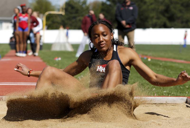 Huntley’s Dominique Johnson long jumps on Thursday, May 8, 2025, during the Fox Valley Conference Girls Track and Field Meet at Huntley High School.