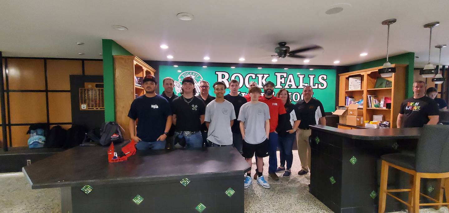 Rock Falls High School seniors; Israel Alvarado, Michael Smit, Michael Flowers Kyler Baldwin (Back Right), and Jonathan Virgili (from Left to Right); celebrate signing day on Friday, May 15.