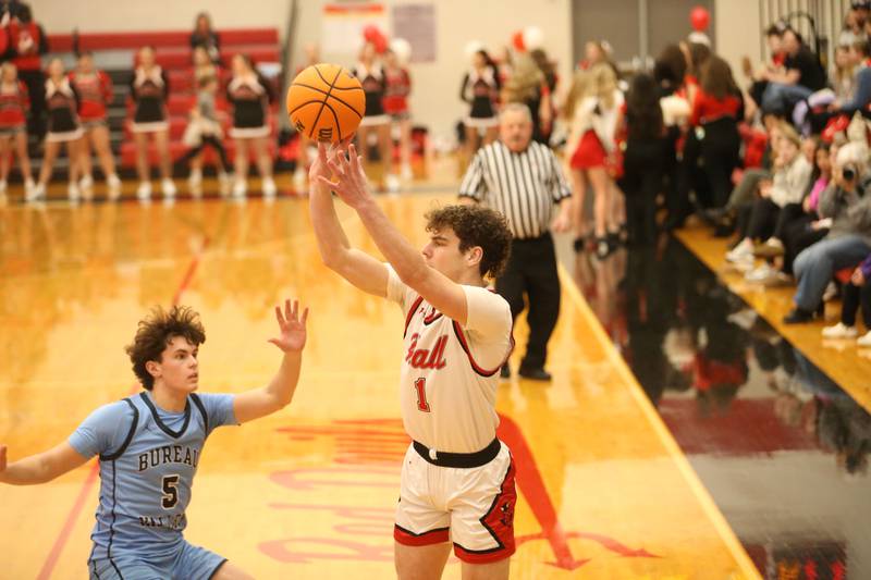 Hall's Chase Burkart lets go of a shot over Bureau Valley's Logan Philhower on Wednesday, Jan. 28, 2026 at Hall High School.