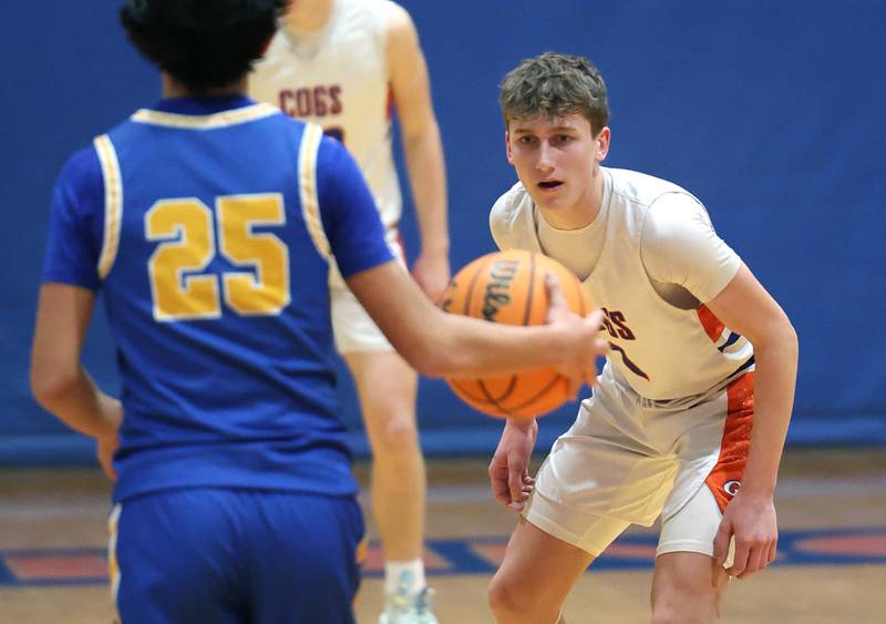 Genoa-Kingston's Kash Sunderlage plays defense against Aurora Central Catholic's Leo Corral Monday, Feb. 23, 2026, during their IHSA Class 2A regional quarterfinal at Genoa-Kingston High School.