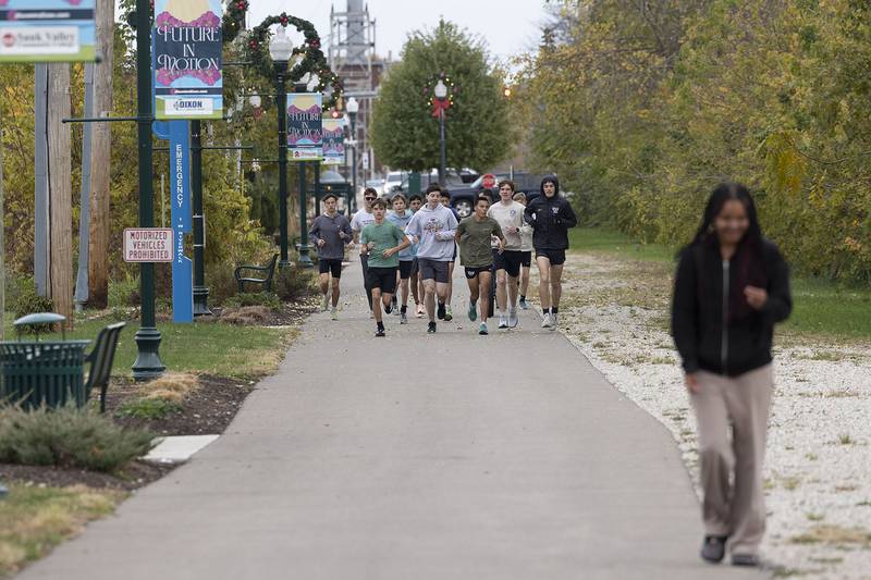 The Dixon boys cross country runs through their drills Thursday, Nov. 6, 2025. The team is gearing up for this weekend’s state tournament.