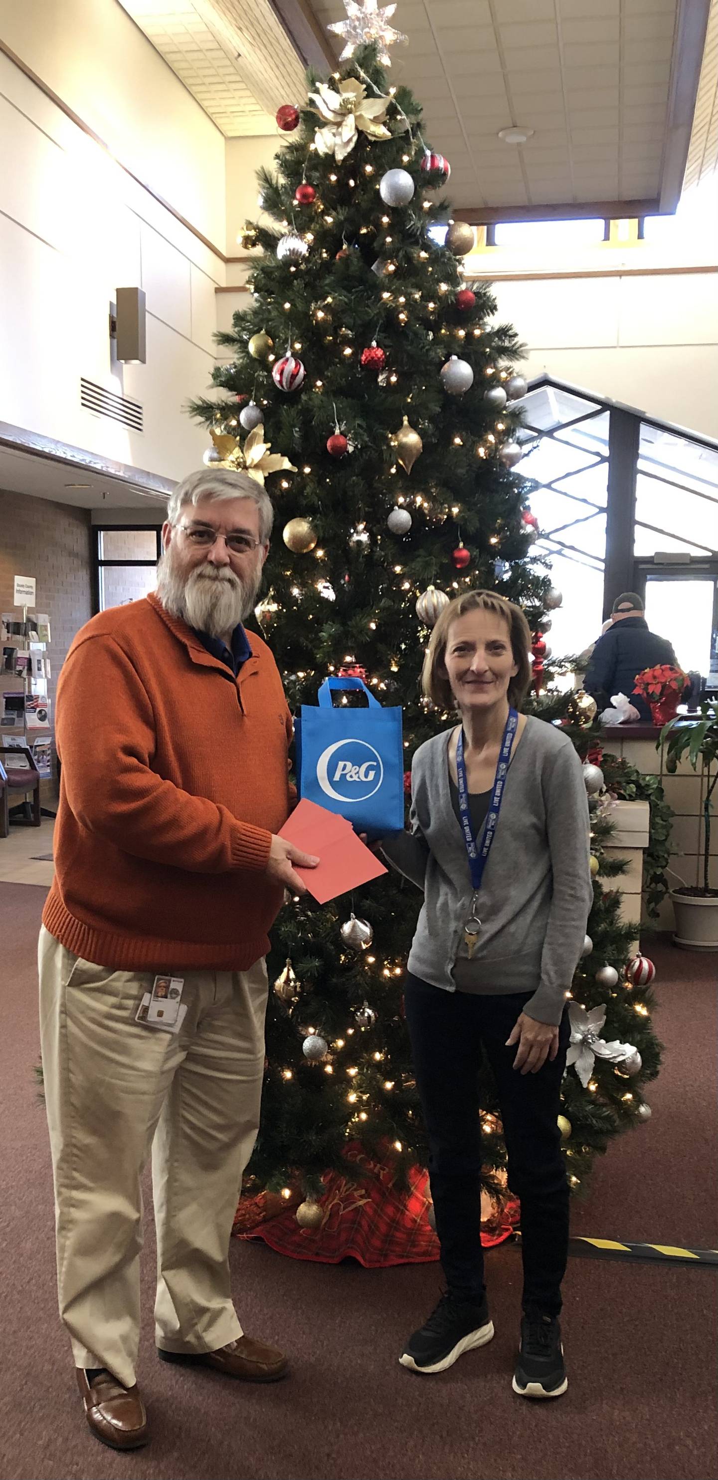 Grundy County Veterans Assistance Commission Director Ken Buck (left) with Karen Nall, Director of the United Way of Grundy County. Buck will be distributing holiday cards from Procter and Gamble.