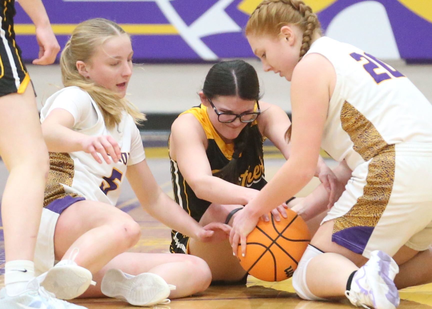 Putnam County's Isabella Gibson forces a jump ball with Mendota's Emily Sondgeroth and Eva Beetz on Tuesday, Feb. 10, 2026 at Mendota High School.